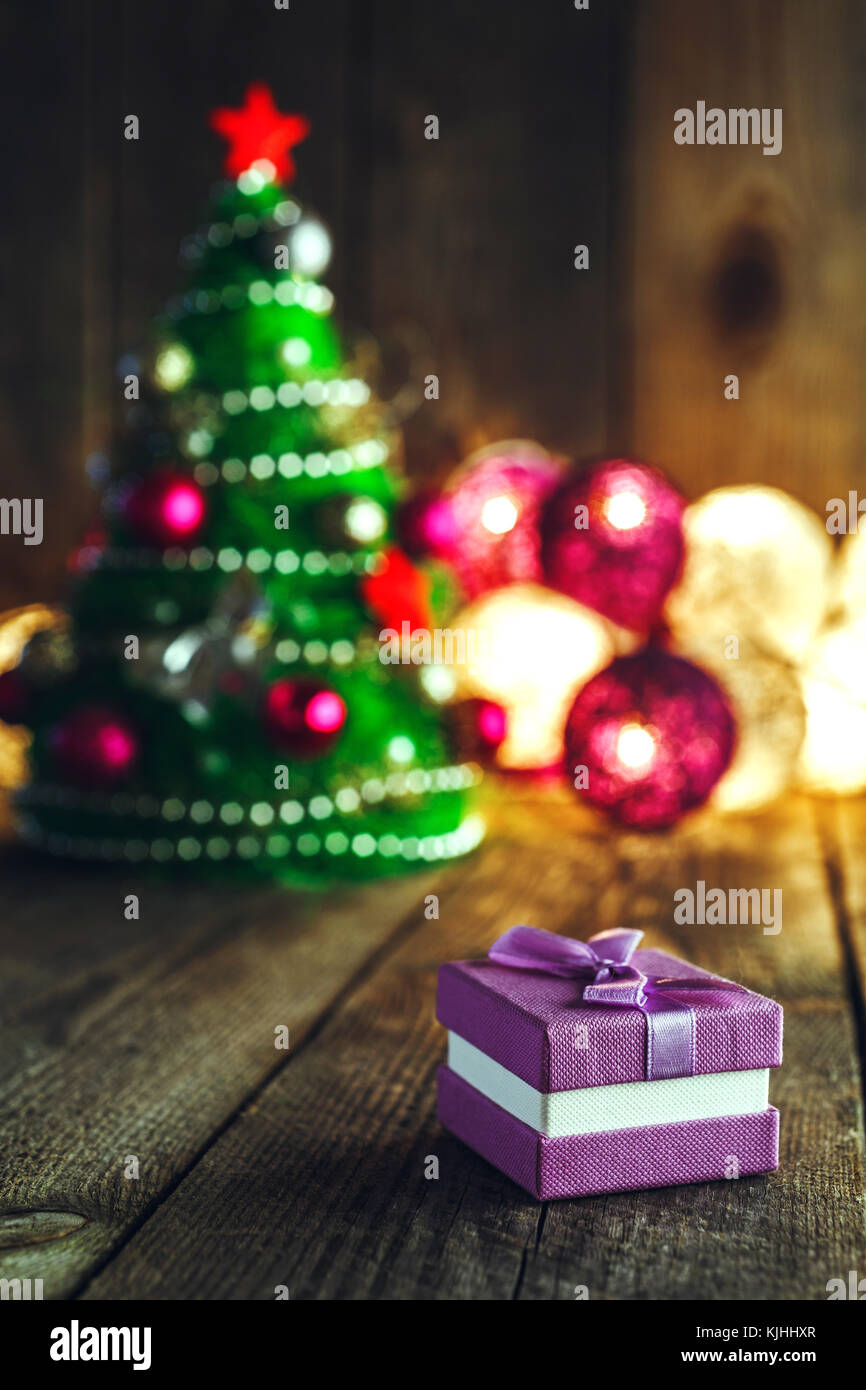 Christmas Background With Decorations And Purple Gift Box On