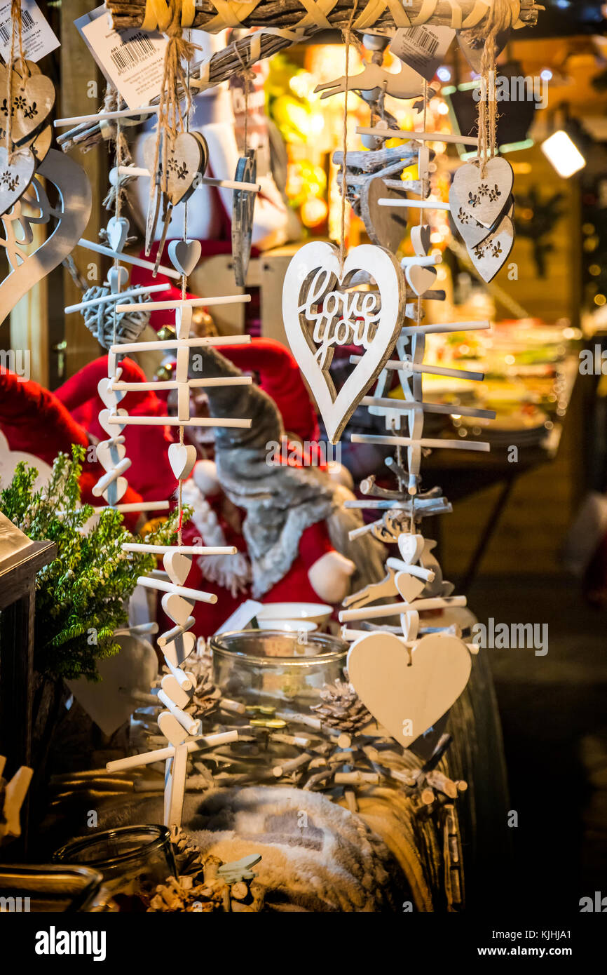 Set of small Christmas wooden decoration gifts (hearts, deer, fir-trees). Xmas and New Year composition Stock Photo