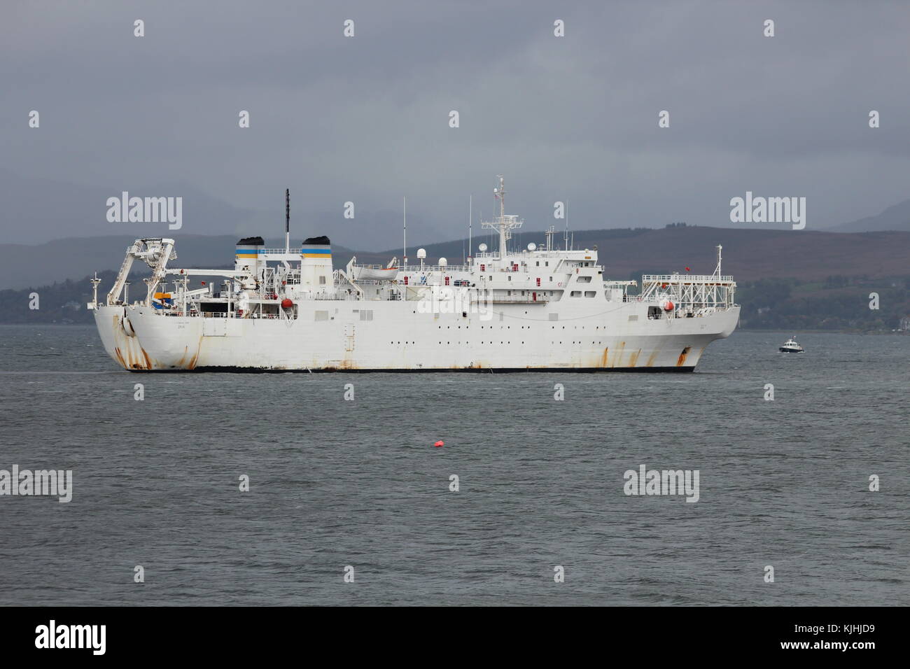 USNS Zeus (T-ARC-7), a Zeus-class cable laying and repair vessel operated by the US Navy, off Gourock on an inbound journey to the Faslane naval base. Stock Photo