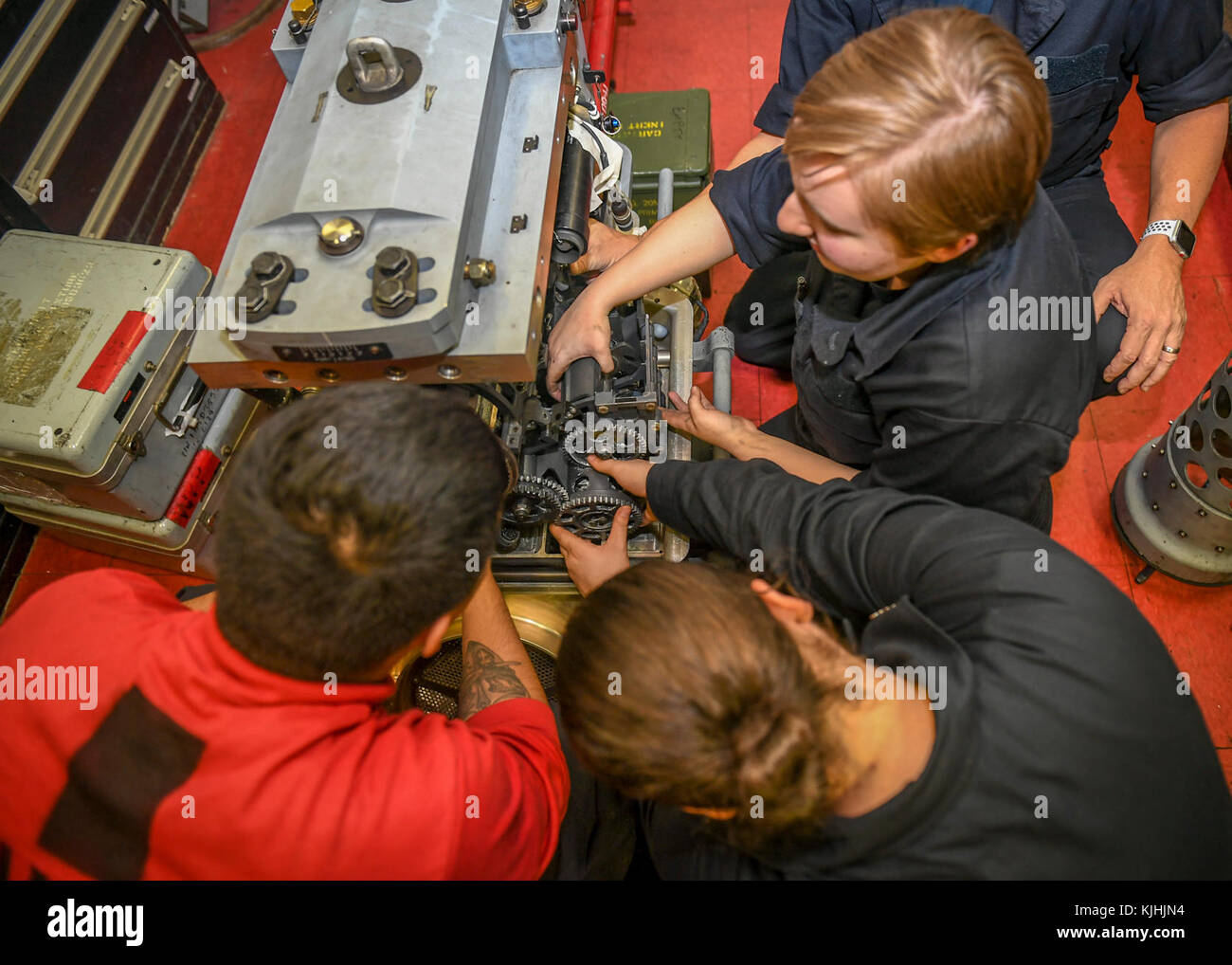 Young naval mechanics repairing machinery Stock Photo - Alamy