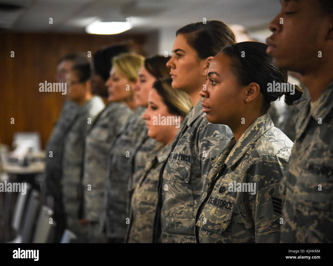 U.S. Air National Guard members stand at attention during a change of ...