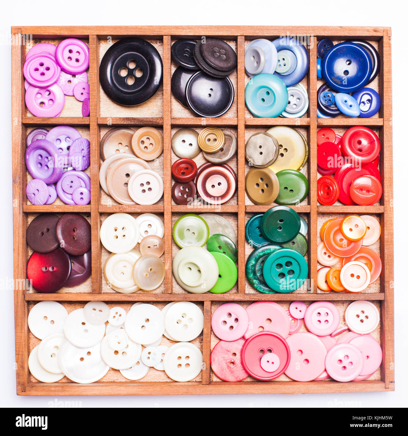 Colorful buttons in a wooden box for design Stock Photo - Alamy