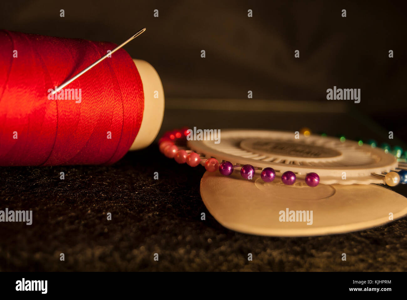 Set tailor: red thread with a needle, white chalk for drawing, a set of ...