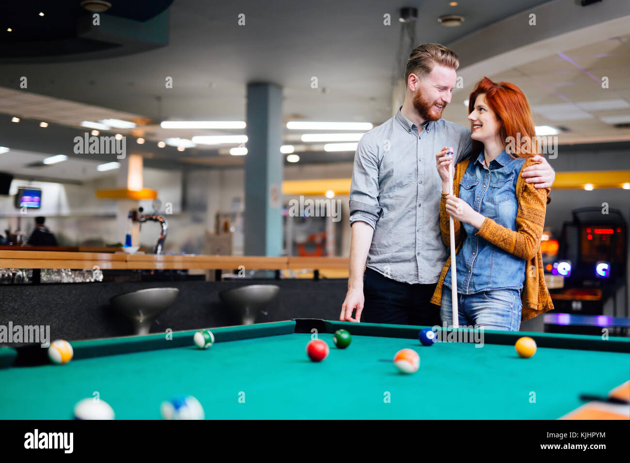 Happy couple playing snooker Stock Photo