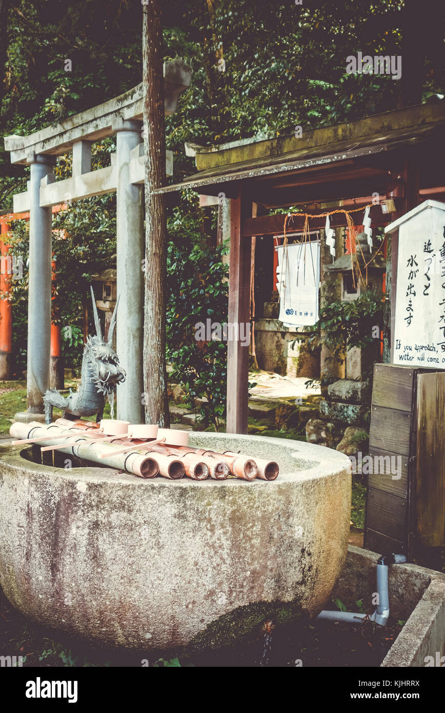 Purification fountain and torii at shoren-in temple, Kyoto, Japan Stock Photo