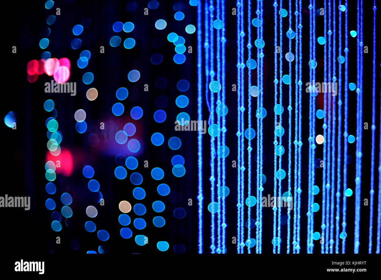 Curtain of strings / chains in blue colour with blue party lights with ...