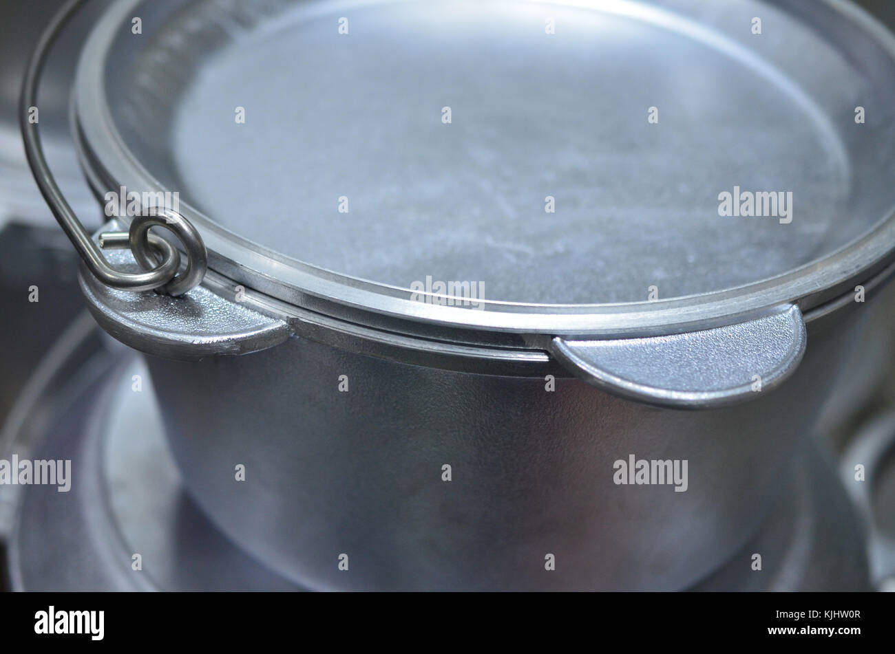 Metal saucepan with a lid for cooking on fire Stock Photo Alamy