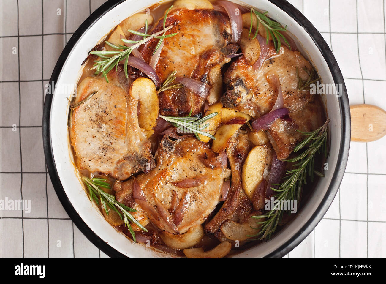 Pork casserole with onion, apple and rosemary Stock Photo Alamy