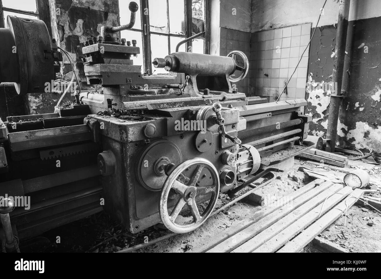 Old abandoned factory rooms, lathes Stock Photo