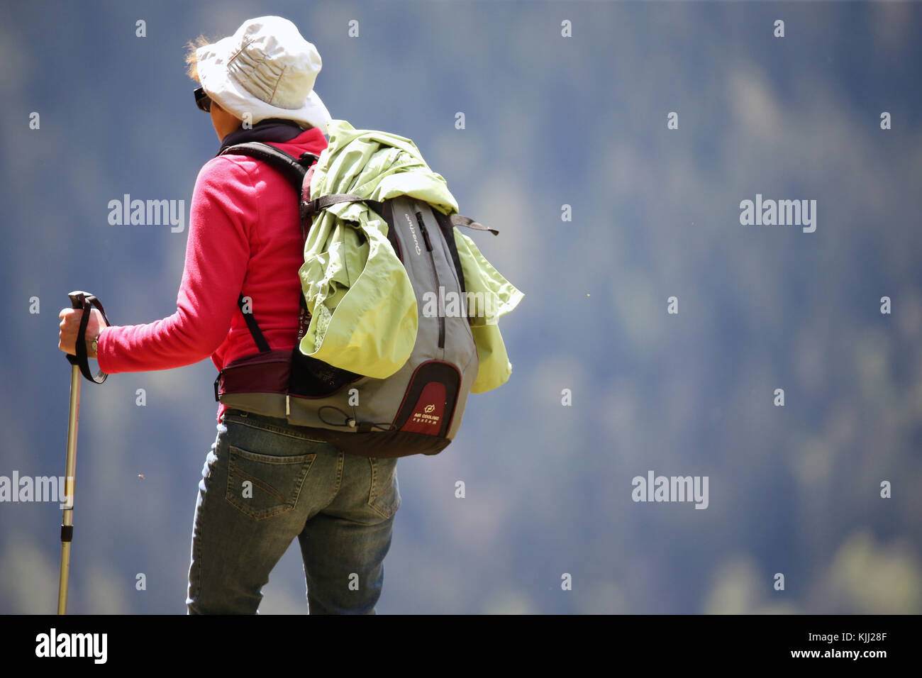 French Alps. Woman hiking on a path.  France. Stock Photo