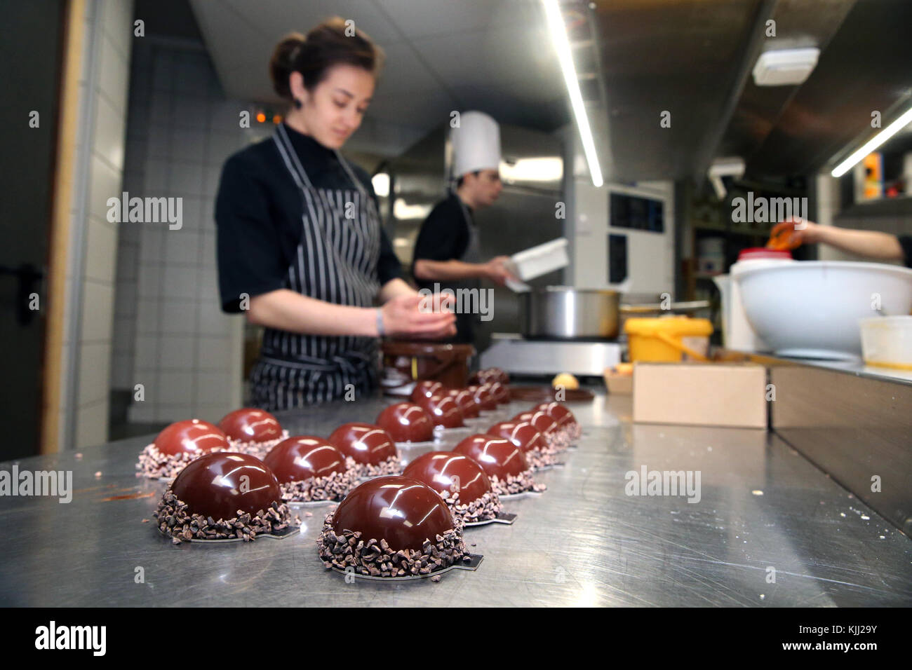 Bakery.  Chocolate cake  dessert being prepared in kitchen.  France. Stock Photo