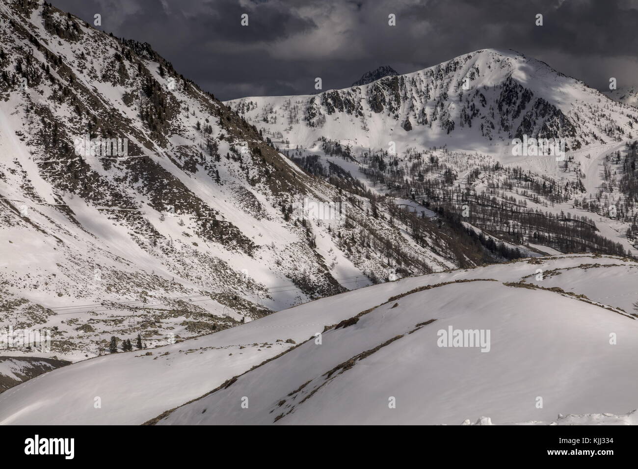 Col de la Lombarde or Colle della Lombarda, on the French-Italian border in spring, looking east into France; Maritime Alps. Stock Photo