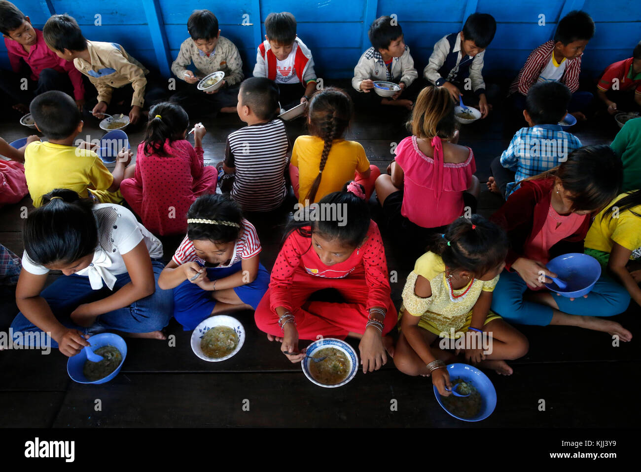 Meal served to children in Chong Khnies floating catholic church on the Tonle Sap lake.  Cambodia. Stock Photo