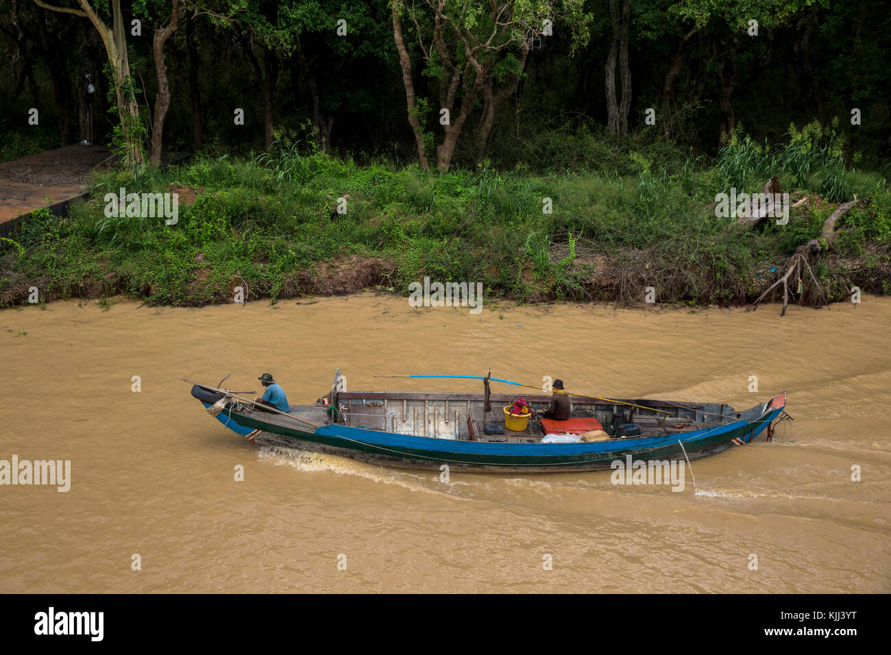 Boat on a tributary of the Tonle Sap. Cambodia. Stock Photo