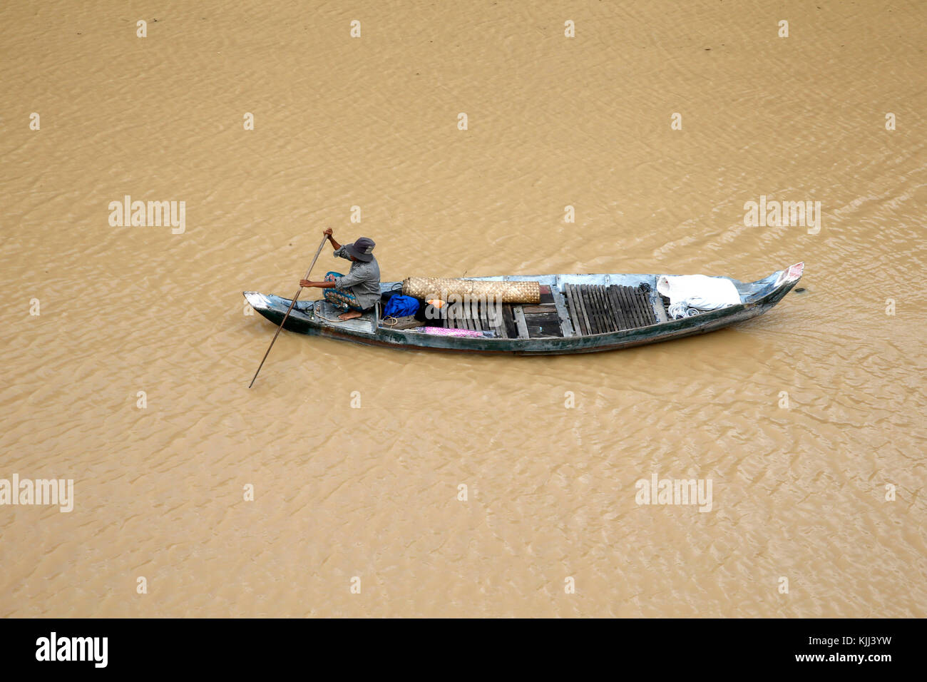 Boat on a tributary of the Tonle Sap. Cambodia. Stock Photo