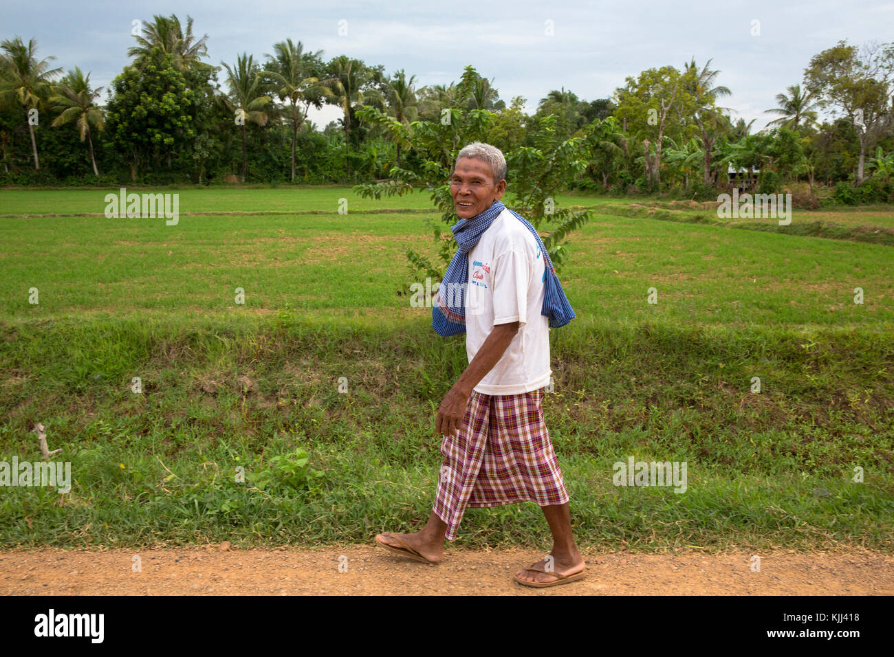 Khmer walking on the outskirts of Battambang. Cambodia. Stock Photo