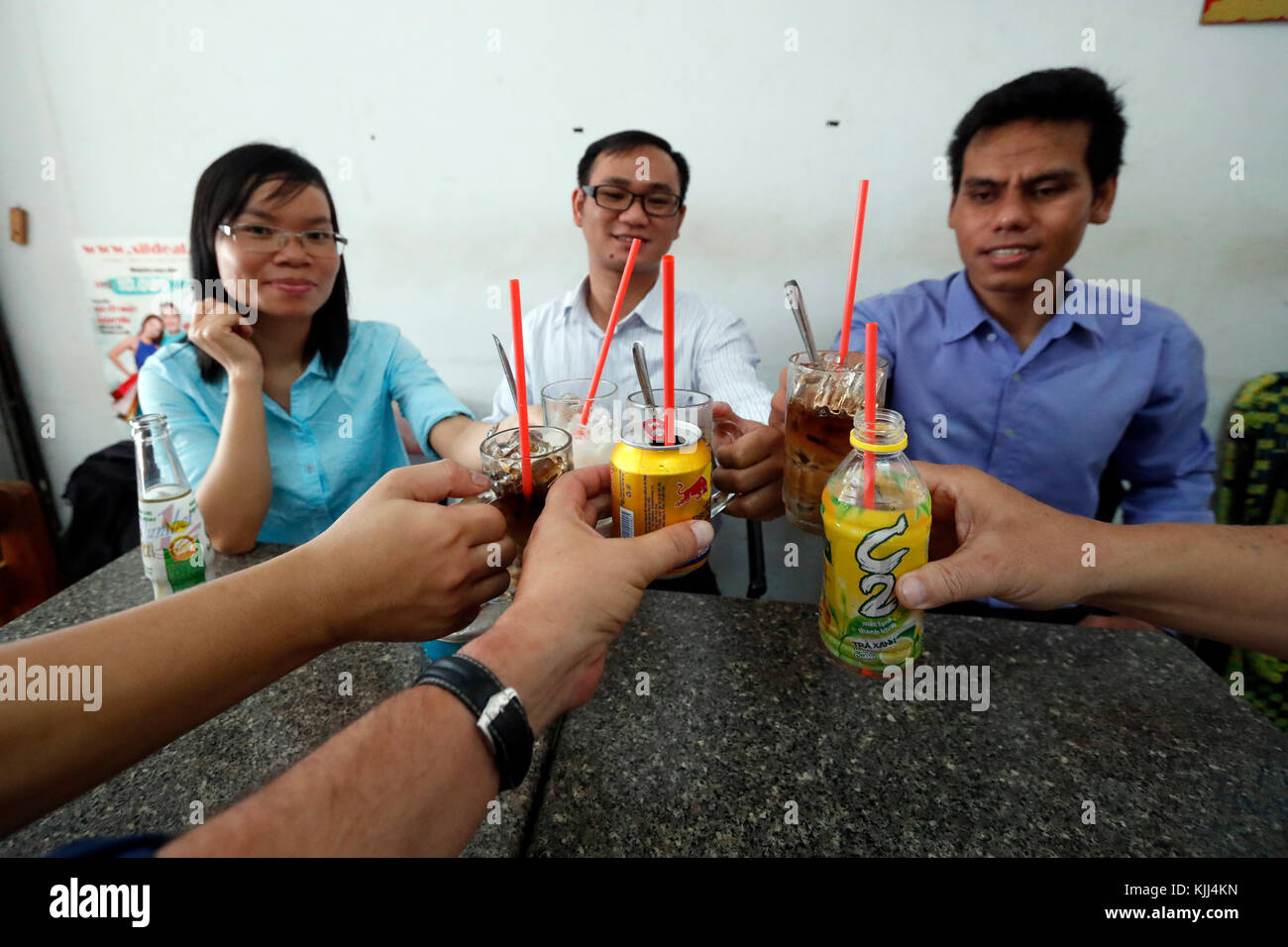 Vietnamese students drinking soda in a coffee. Ho Chi Minh City. Vietnam. Stock Photo