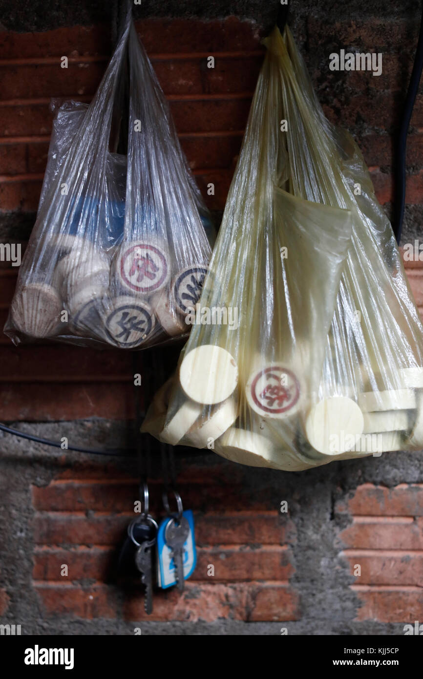 Chinese chess pieces in plastic bag. Kon Tum. Vietnam. Stock Photo