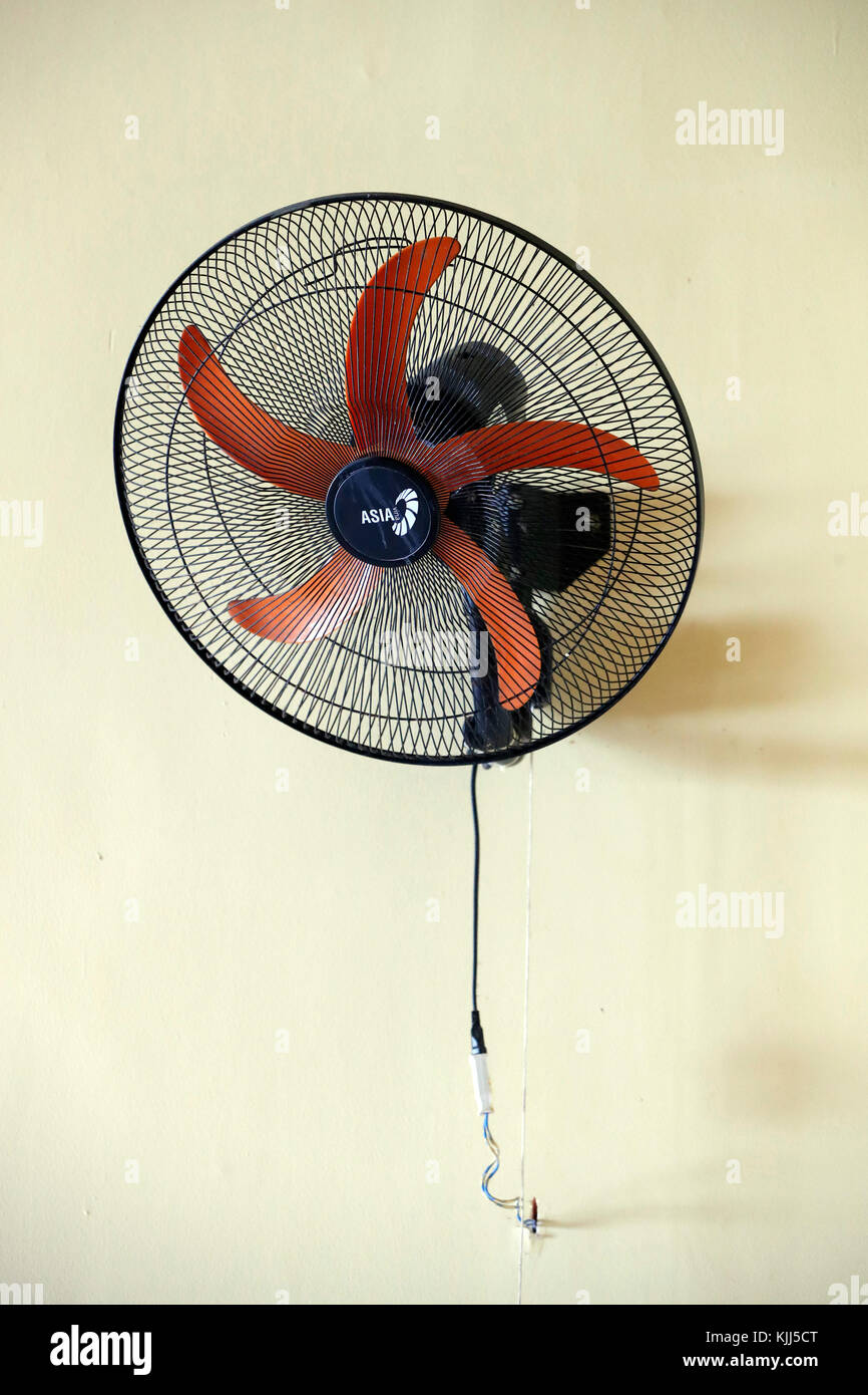 Electric fan on a wall. Vung Tau. Vietnam. Stock Photo