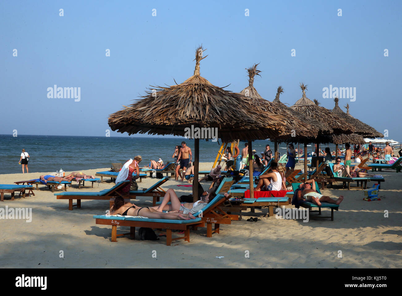 Deck chairs on sandy beach.  Hoi An. Vietnam. Stock Photo
