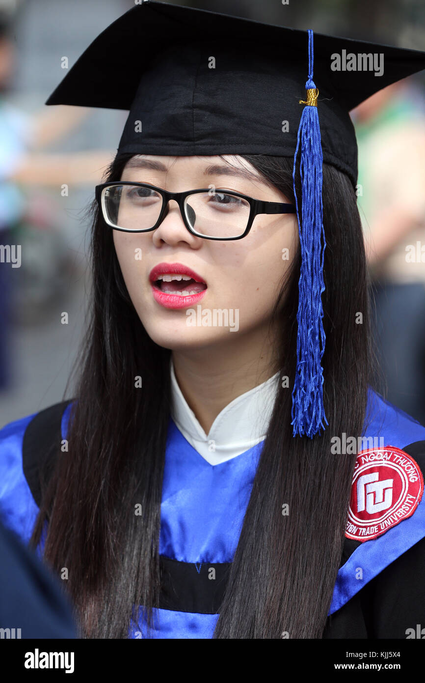 Young Asian university student wearing cap and gown.  Ho Chi Minh City.  Vietnam. Stock Photo
