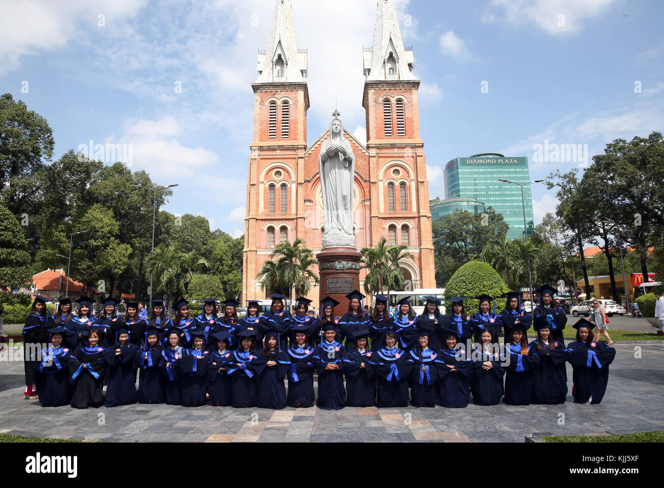 Group of Young Asian university students wearing cap and gown.  Ho Chi Minh City.  Vietnam. Stock Photo