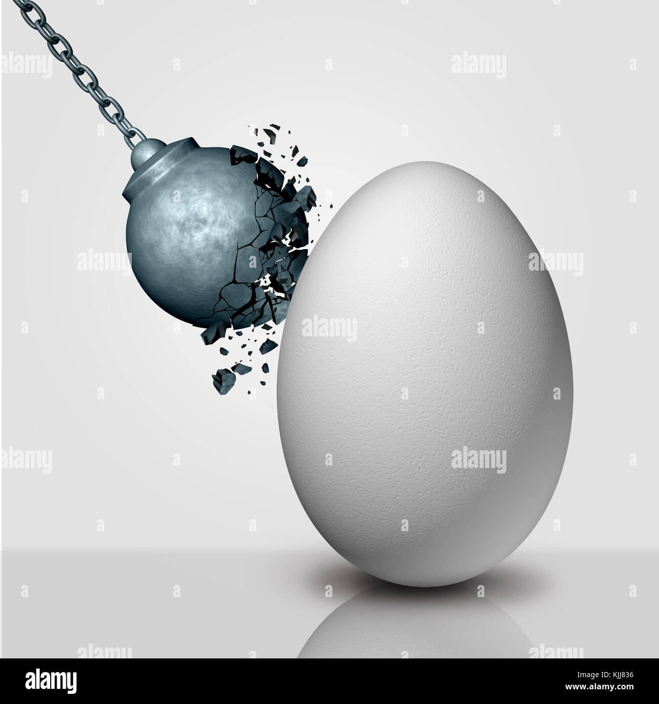 Inner strength concept and stamina or durability metaphor as a wrecking ball being destroyed by an egg as a durability and persistence icon. Stock Photo
