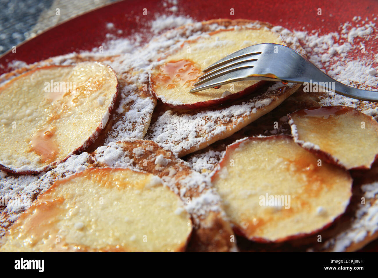 Dutch pancakes at a canalside cafe in the Autumn sunshine, in Amsterdam
