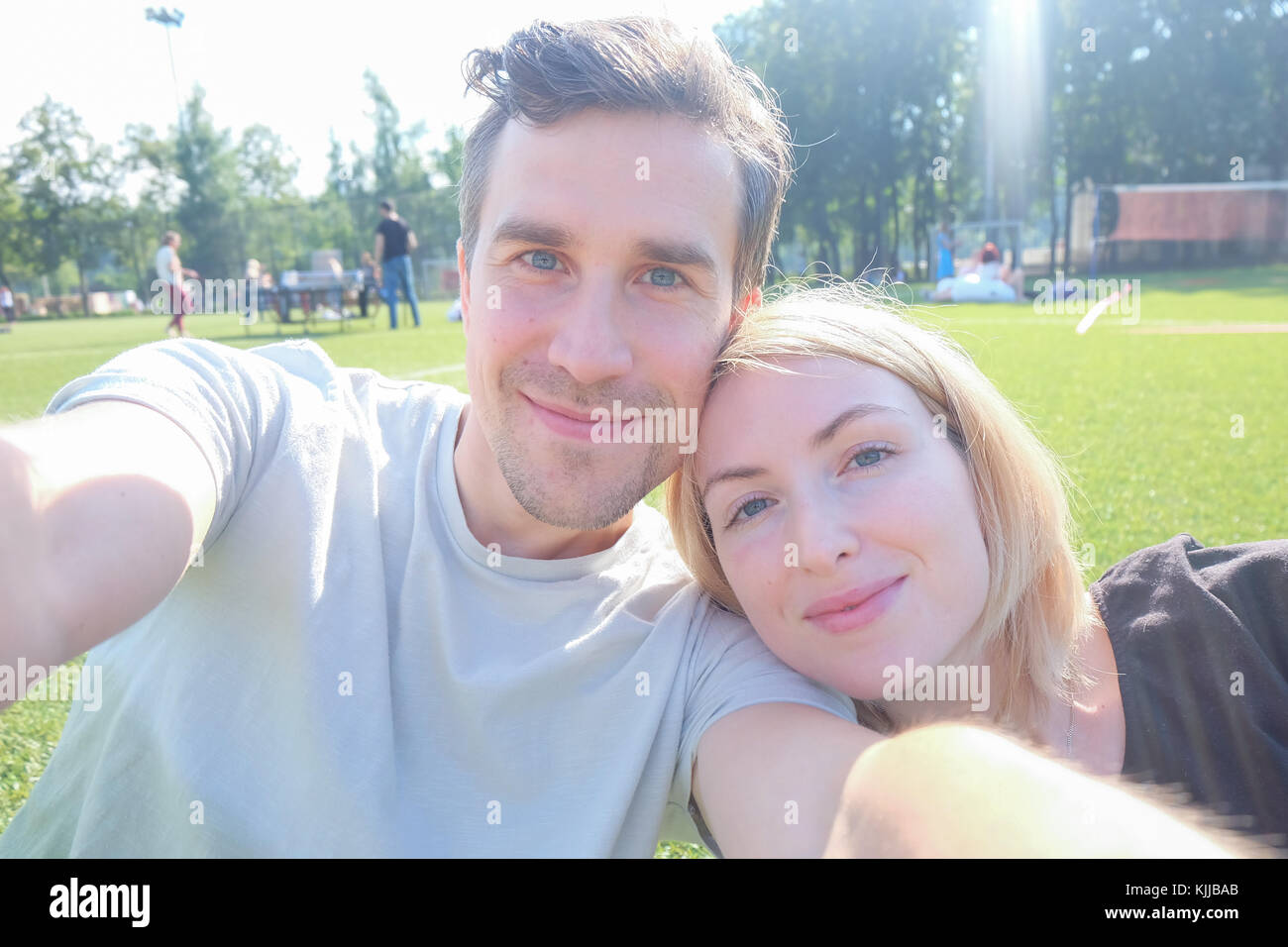 Happy young couple taking selfie Stock Photo - Alamy