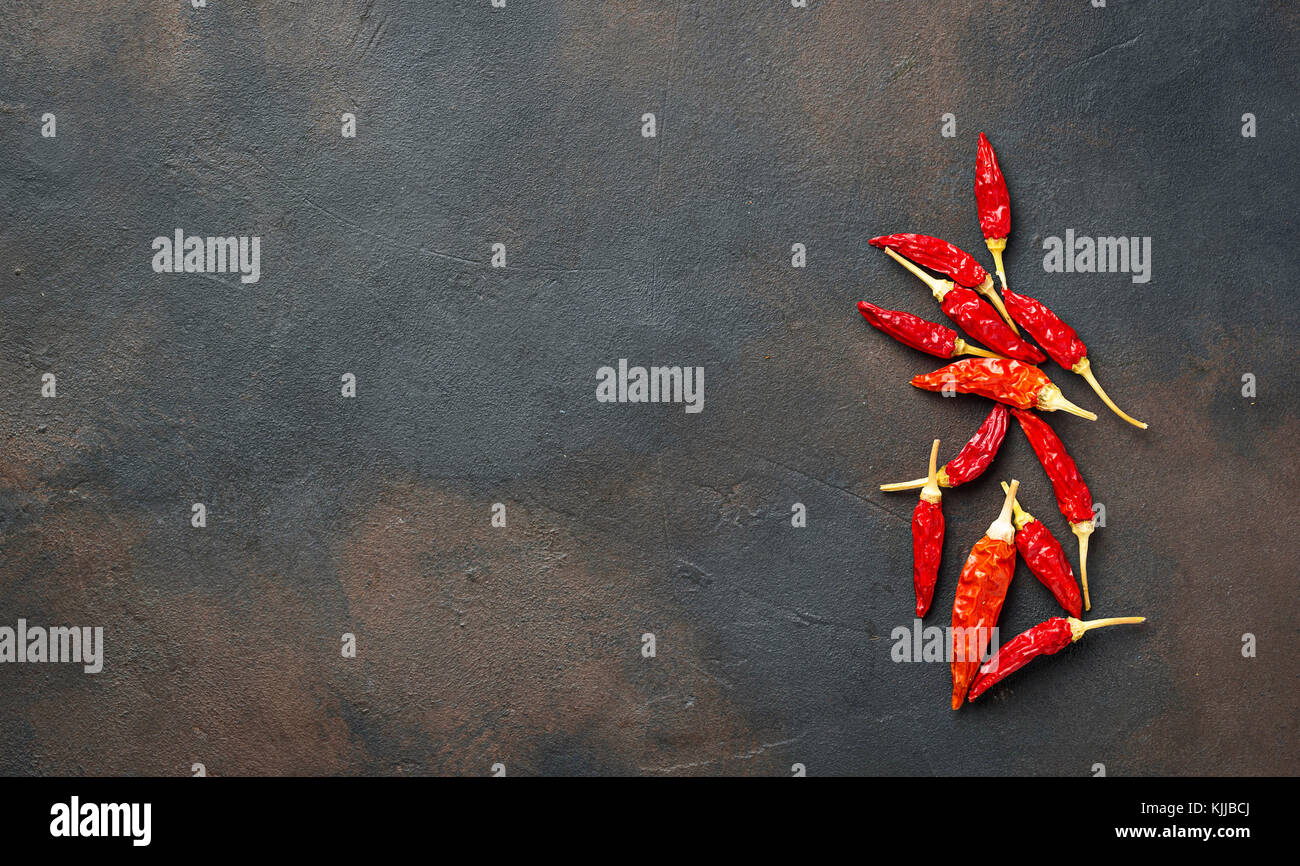 Red hot chili peppers on rusty background. Top view Stock Photo - Alamy