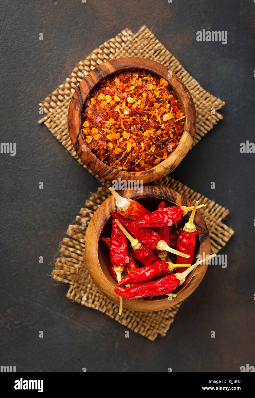 Red hot chili peppers on rusty background. Top view Stock Photo - Alamy