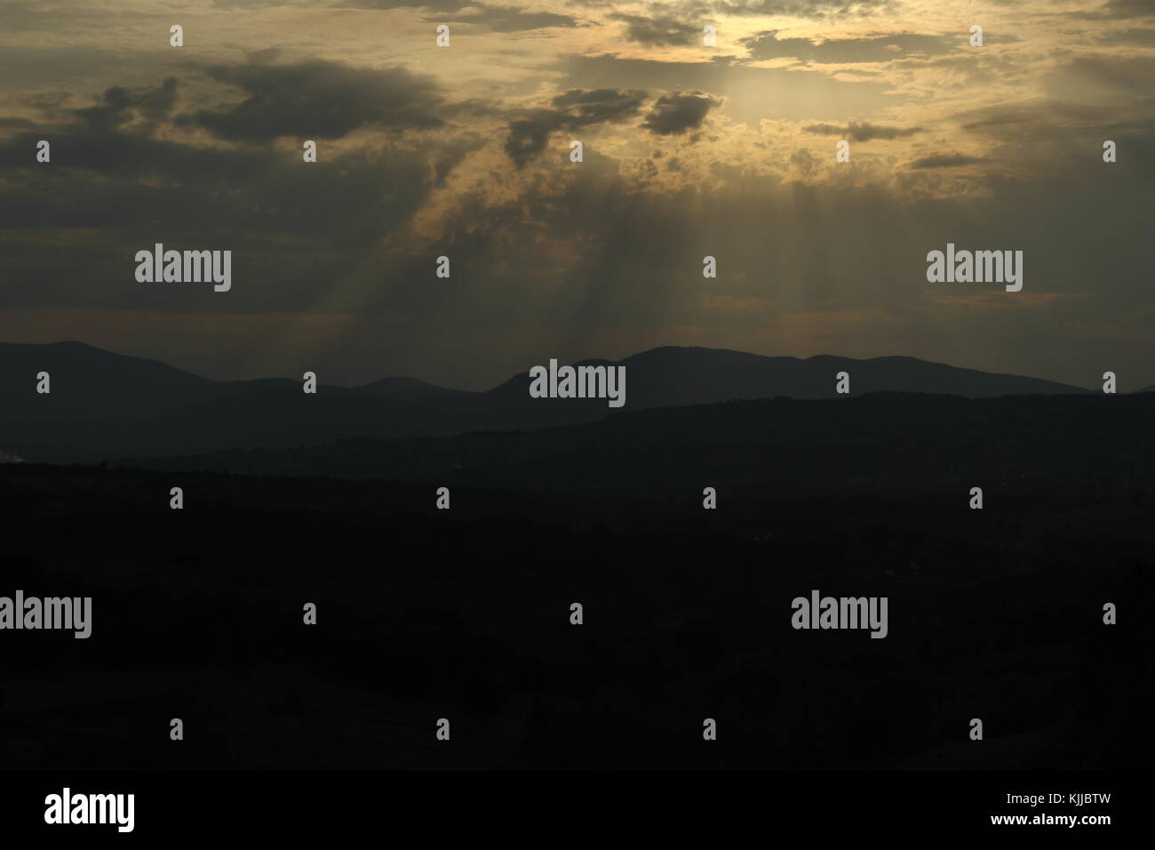 sunset over mountains Stock Photo - Alamy
