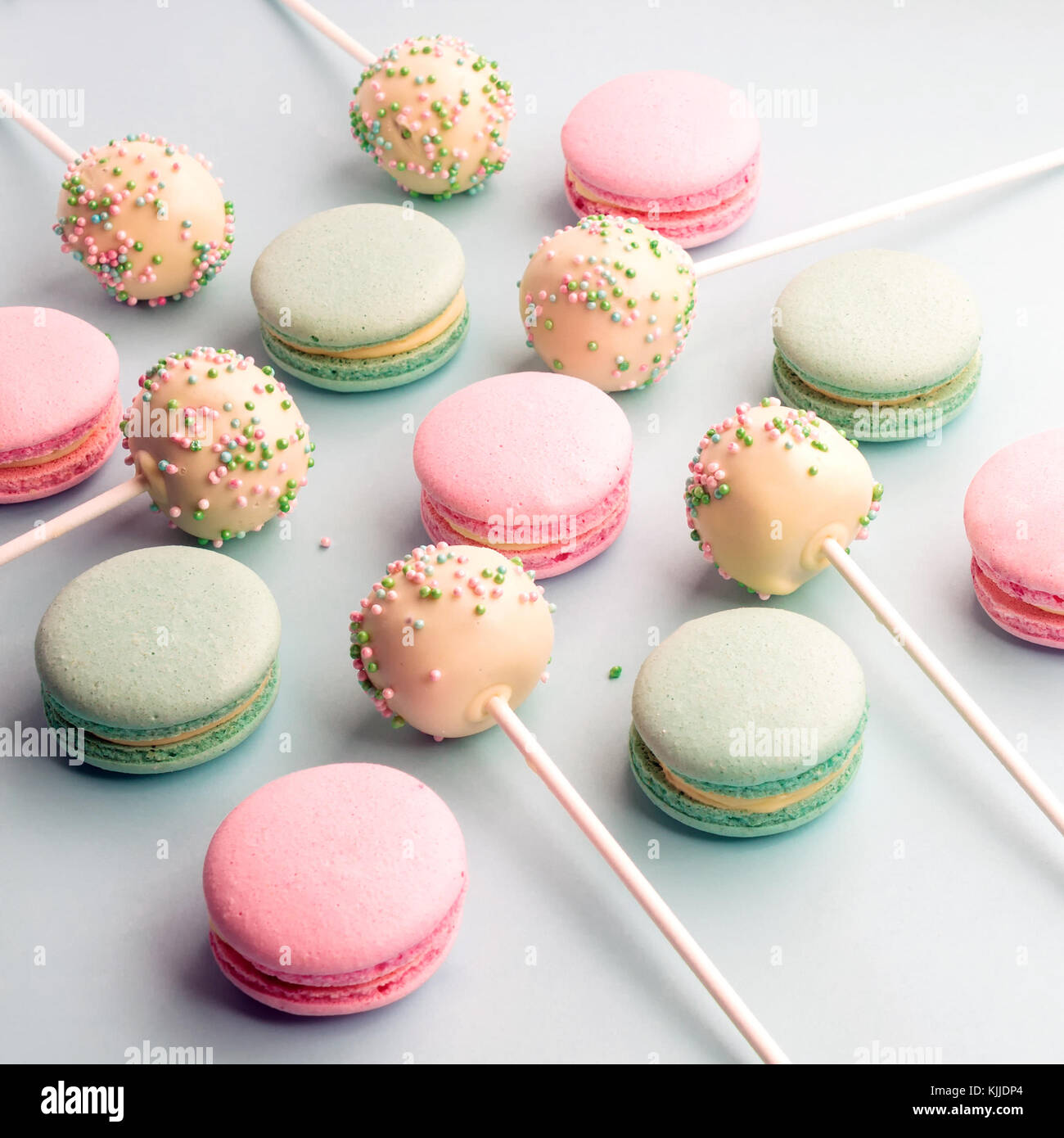 Background of colorful macaroons with cake pops Stock Photo