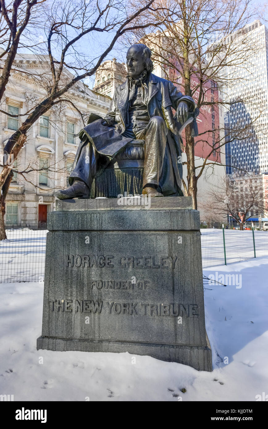 A memorial dedicated to Horace Greeley, the founder of the New York Tribune, in downtown New York City in the winter. Stock Photo