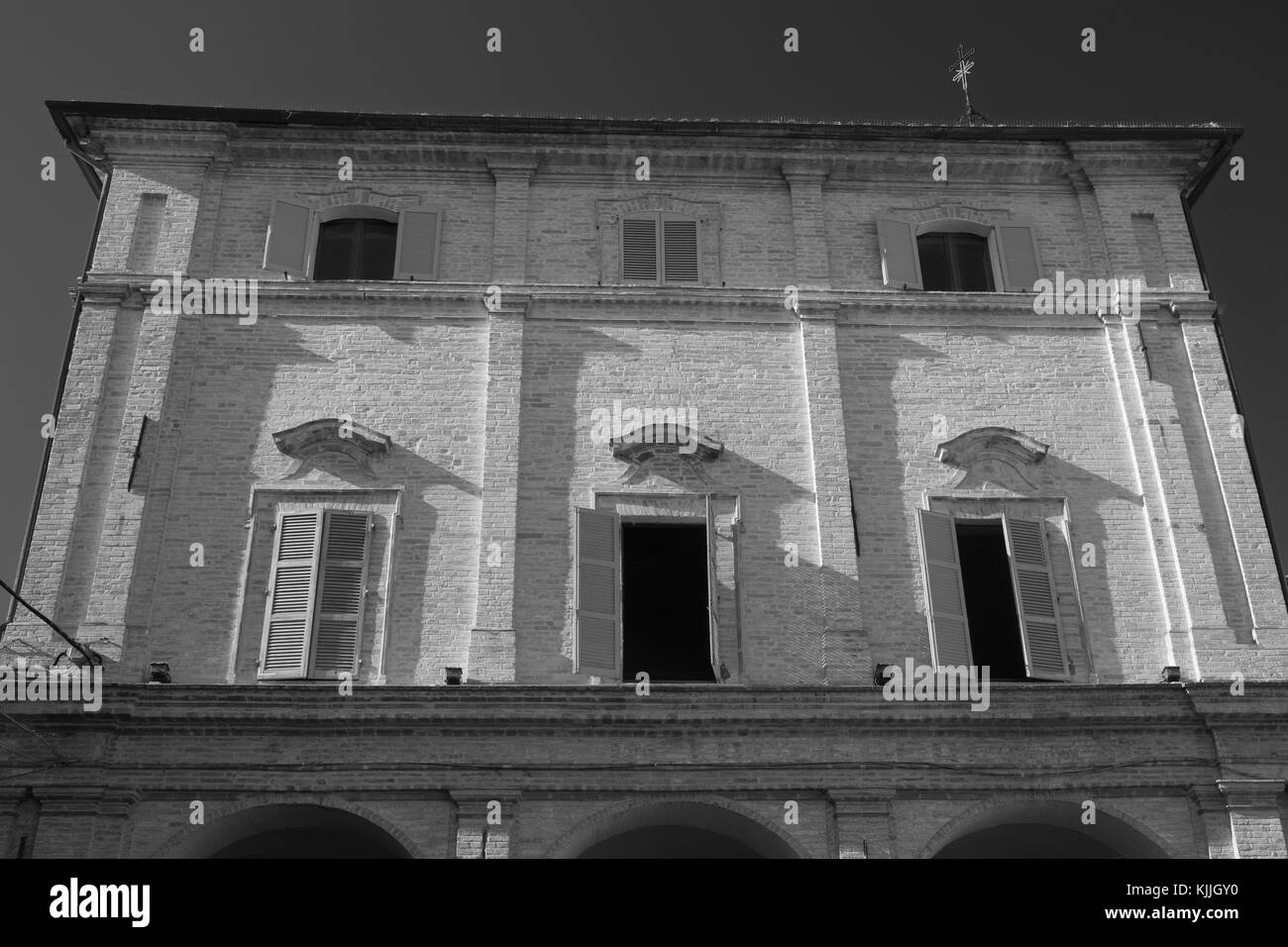 Monte San Giusto (Macerata, Marches, Italy): historic town. Palace facade. Black and white Stock Photo