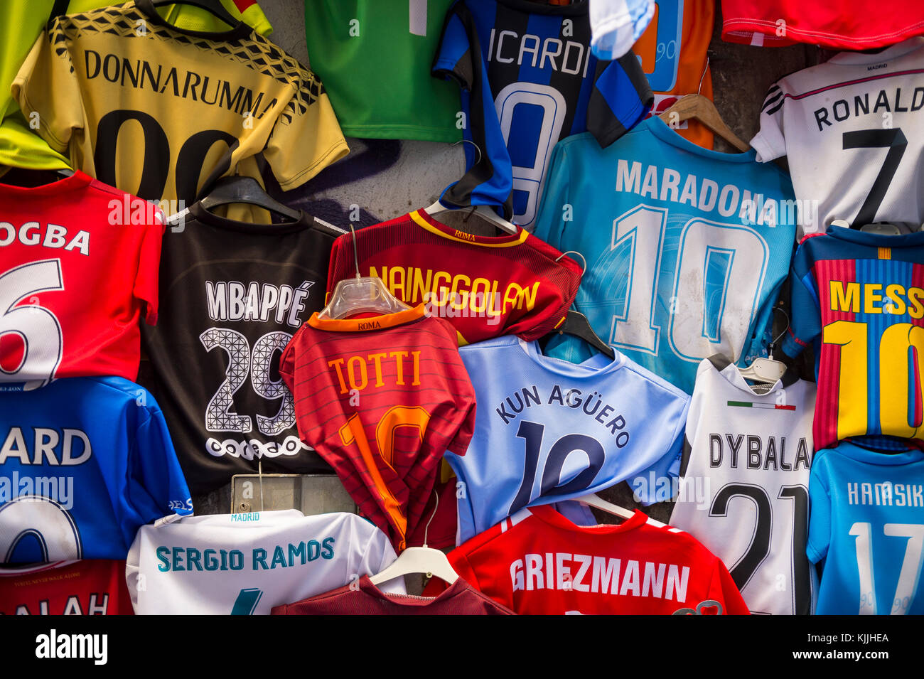NAPLES, ITALY - OCTOBER 12, 2017: Colorful second-hand soccer team shirts  with player names and numbers hanging at a street market stall in the  histor Stock Photo - Alamy