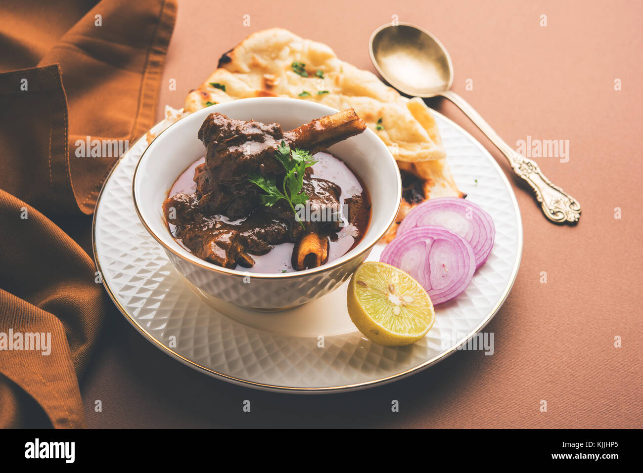 Mutton Masala Or Masala Gosht or indian lamb rogan josh with some seasoning, served with Naan or