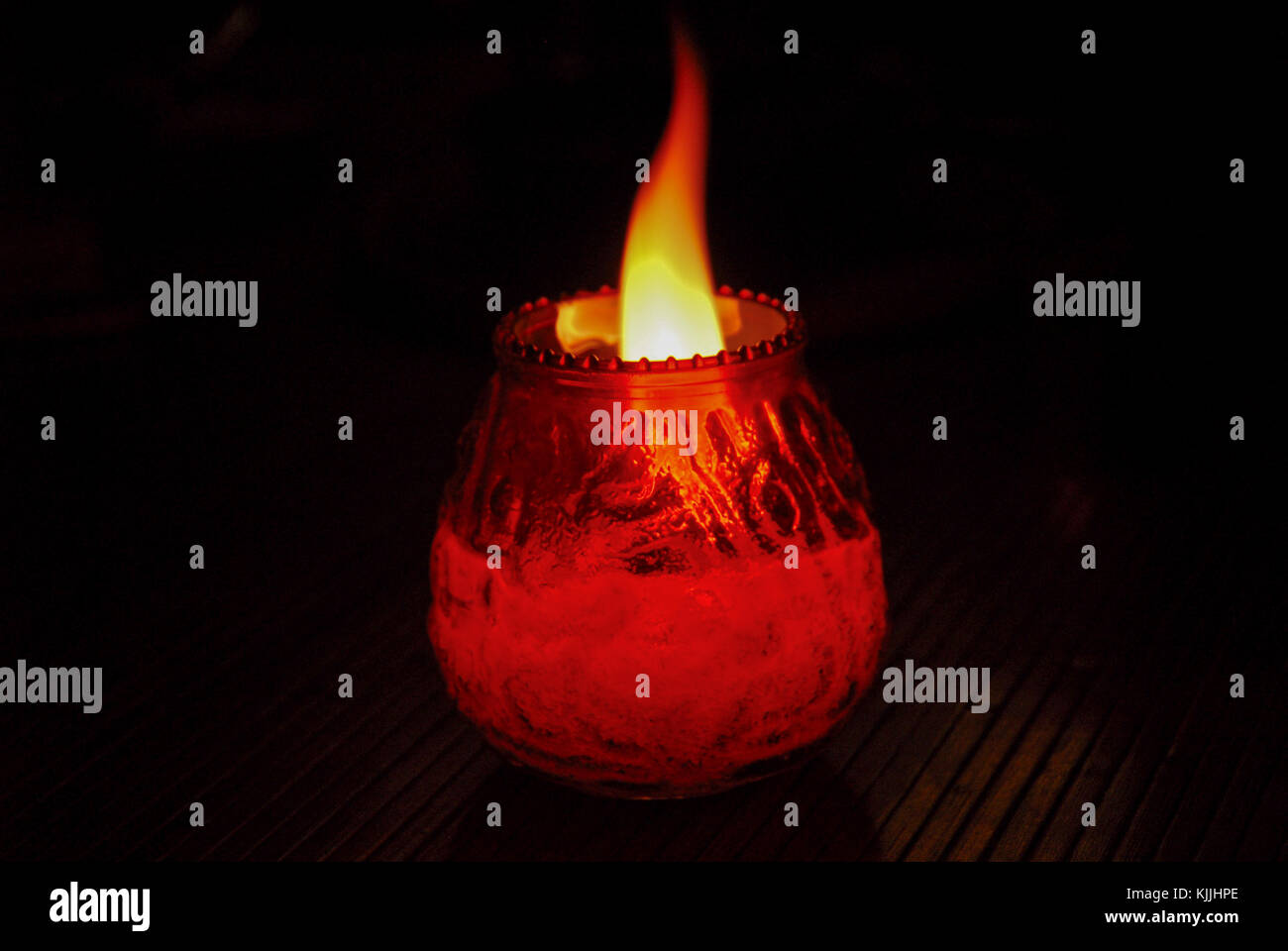 Flaming candle in a jar at night Stock Photo Alamy