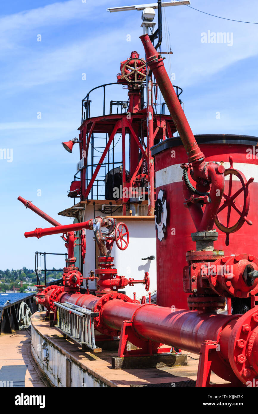 An old fire boat with red pipes, tanks and hoses Stock Photo Alamy