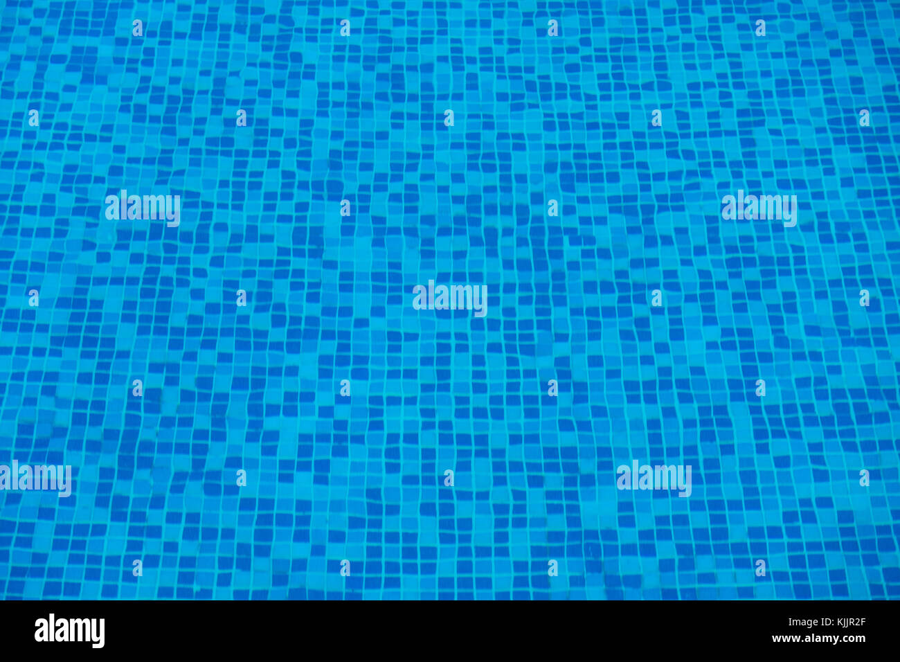 Blue abstract mosaic tiles at the bottom of the swimming pool ...