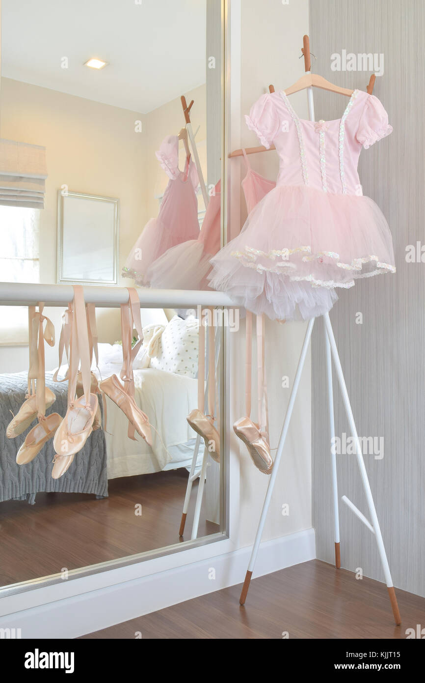 Girl S Pink Dress And Ballet Shoes Hang On Bar In Bedroom