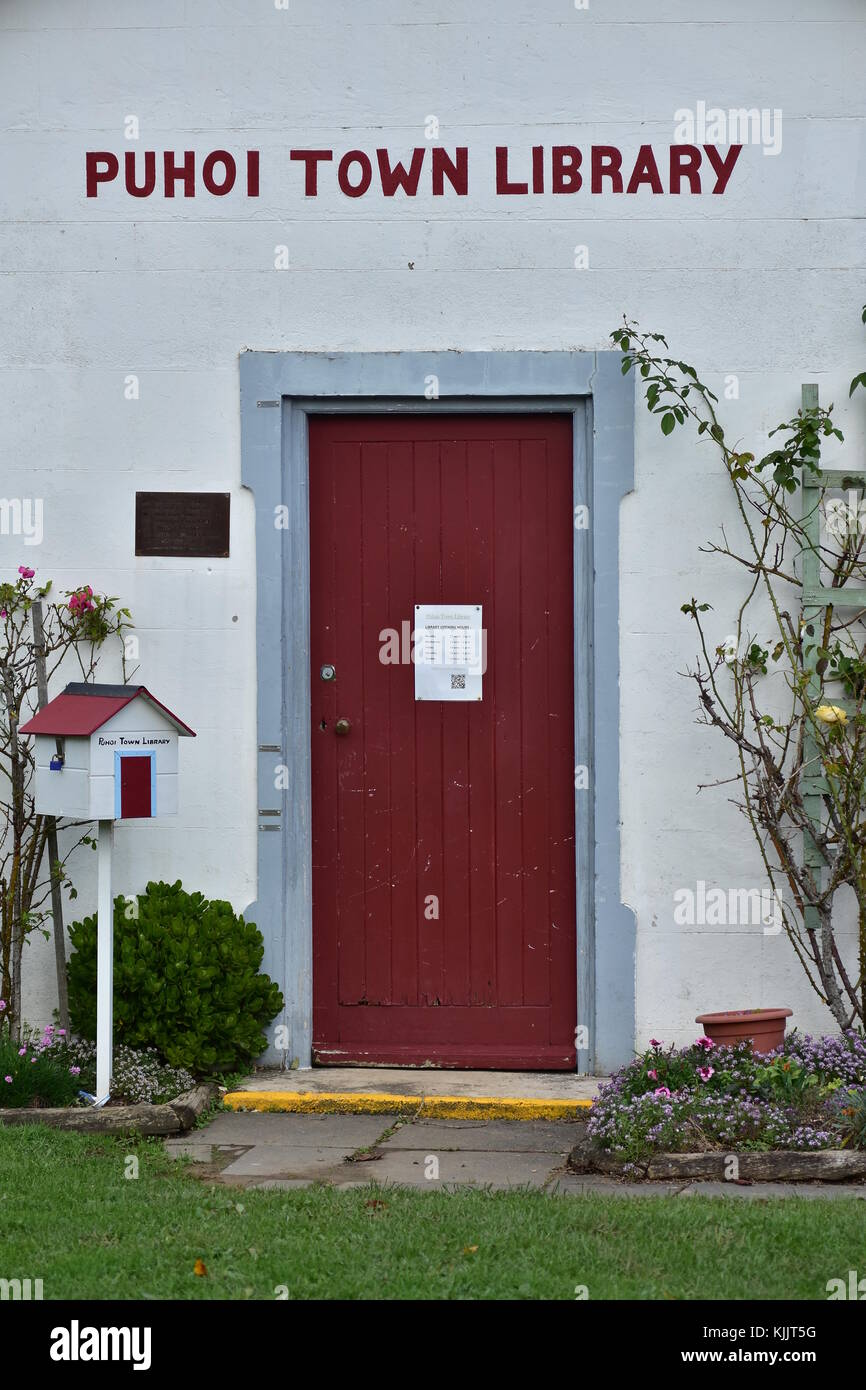 Red wooden door on tiny library building in Puhoi village near Auckland. Stock Photo