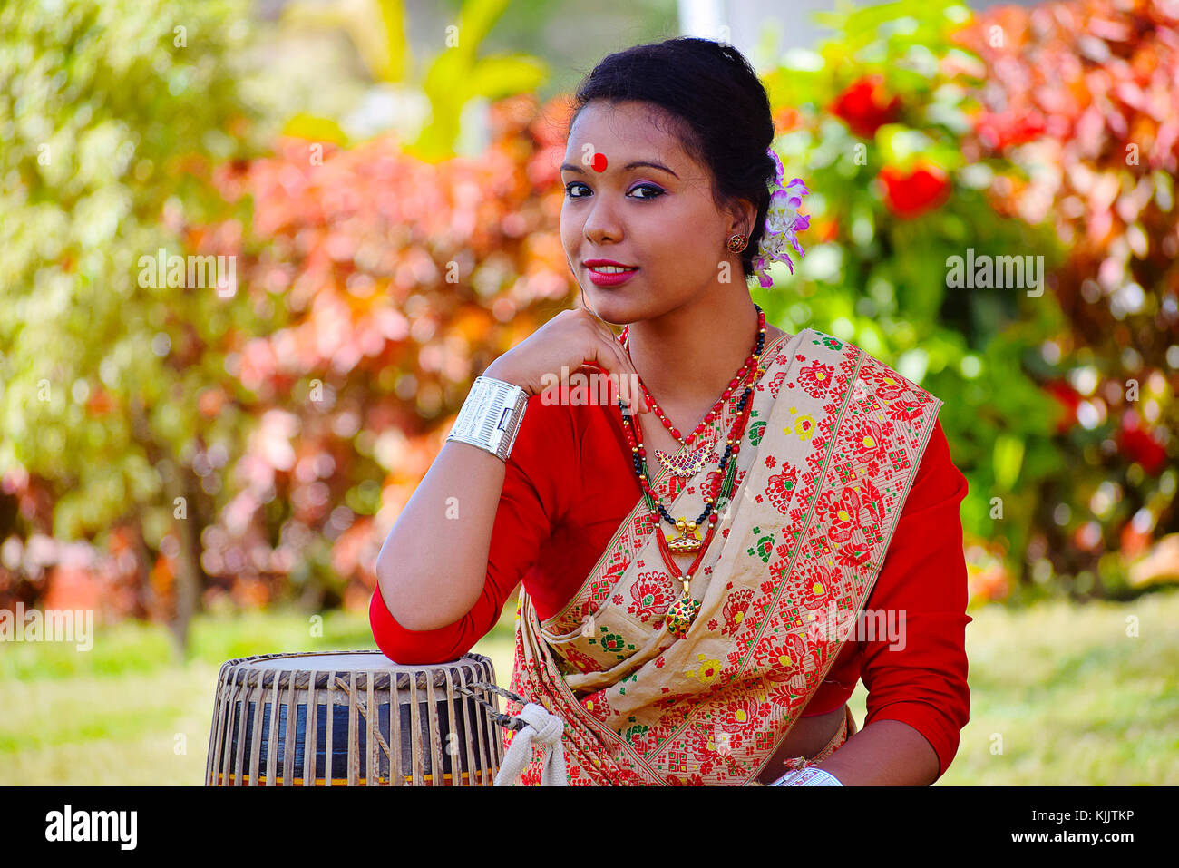 Assamese girl In traditional attire posing with A Dhol(Drum), Pune, Maharashtra. Stock Photo