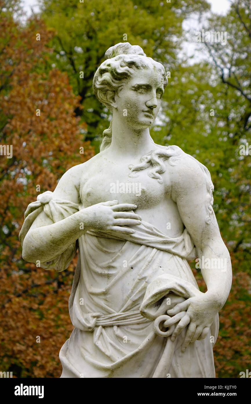 A God statue at public park with autumn trees in St. Petersburg, Russia ...
