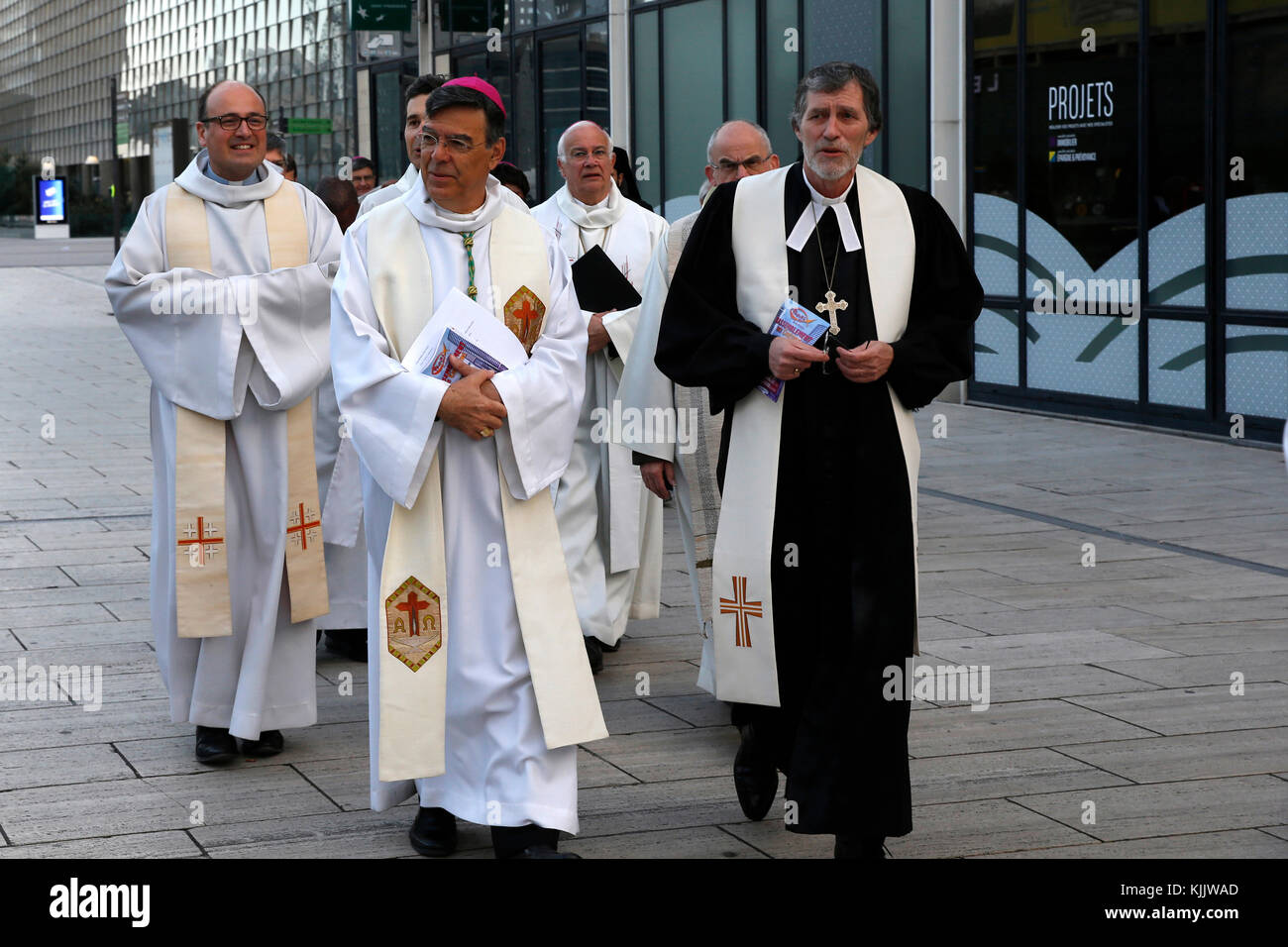 Ecumenical prayer meeting at dawn on Easter sunday in Paris-La Defense, France. Arrival of clergymen. Stock Photo