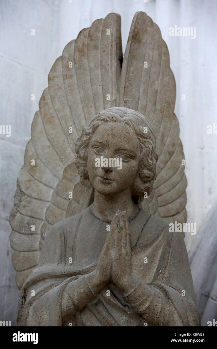 Notre Dame church, Dives sur Mer. Angel statue. Stock Photo