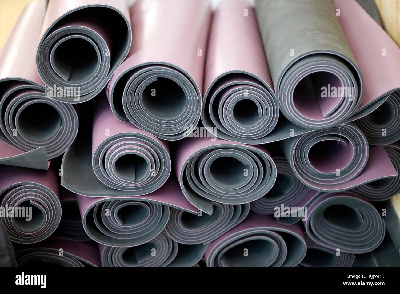 Rolled-up yoga mats.  France. Stock Photo