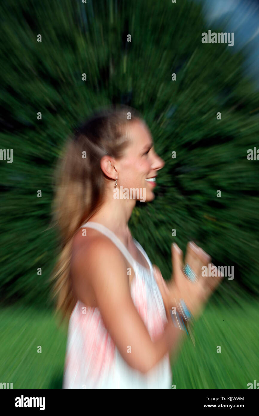 Blurred Motion Of Young Woman Practicing Yoga.  France. Stock Photo