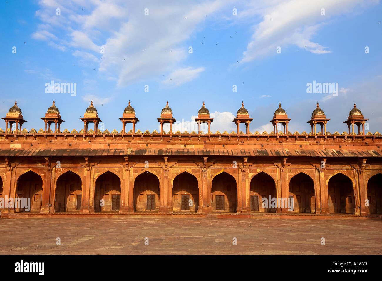 Fatehpur Sikri, founded in 1569 by the Mughal Emperor Akbar, served as the capital of the Mughal Empire from 1571 to 1585.  Surrounding wall of the Ja Stock Photo