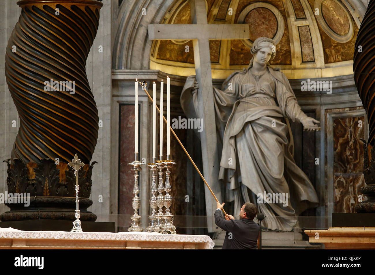 Lighting candles in St Peter's basilica chancel, Rome. Italy Stock